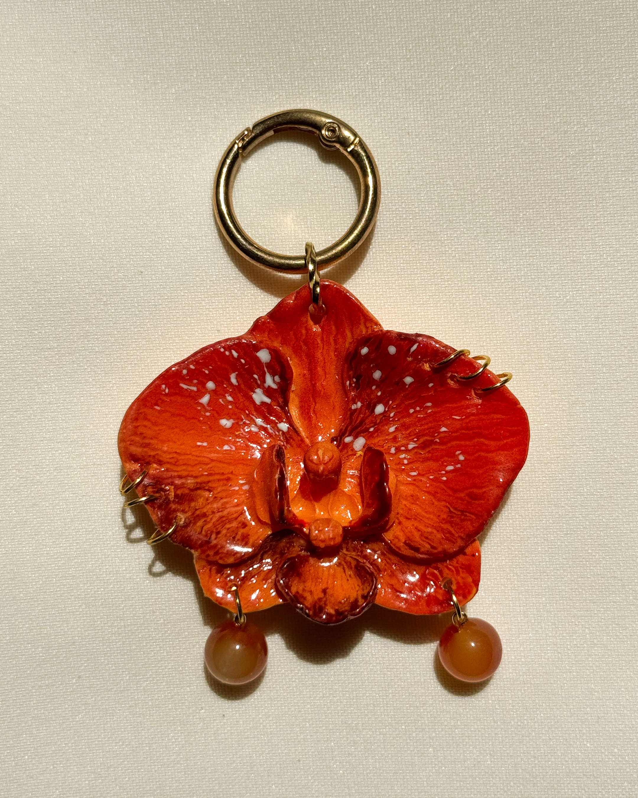 Narancs Orchidea Táskadísz