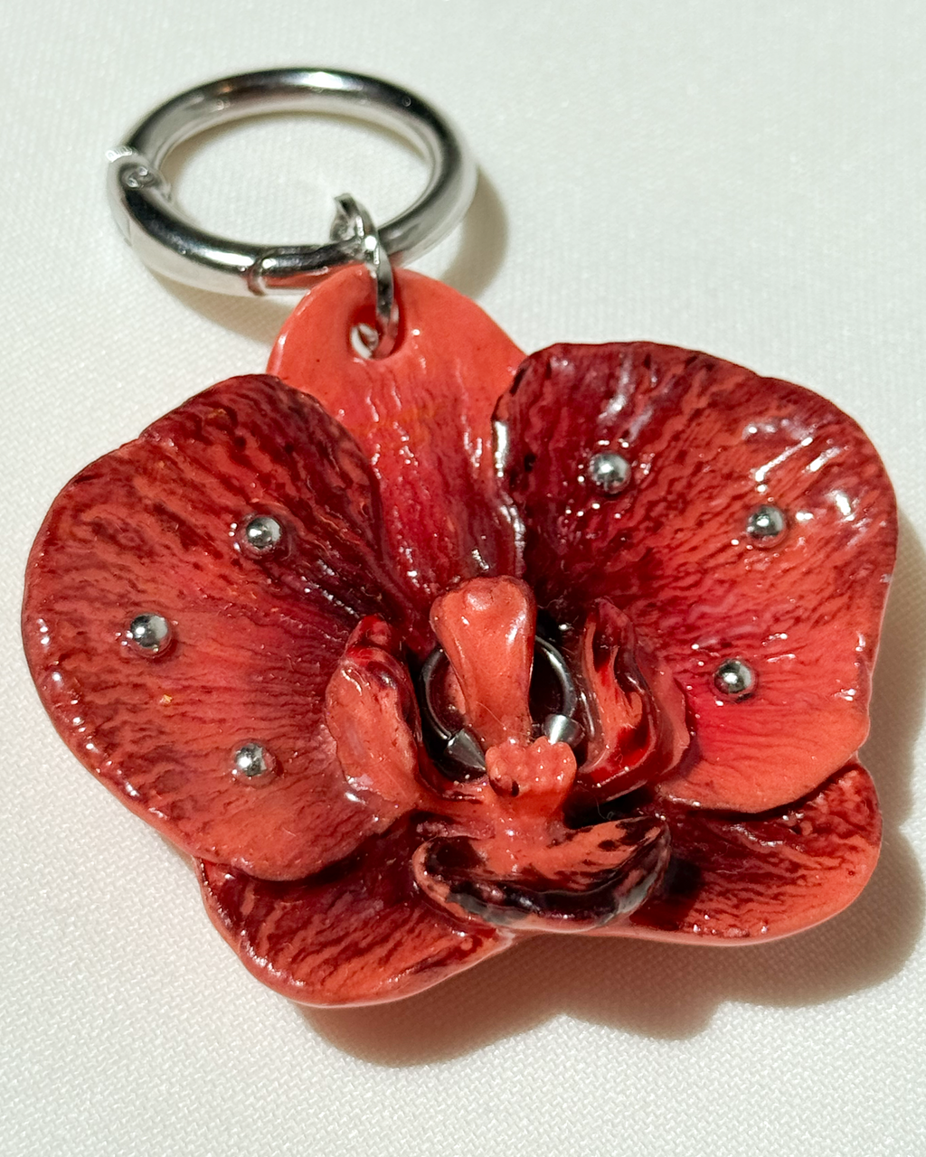 Narancs Orchidea Táskadísz